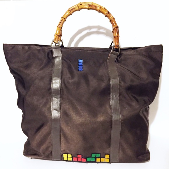 Gucci Handbags - Gucci brown nylon Tetris tote travel bag